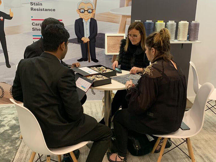 Discussing Textile Samples at Domotex Germany 2020
