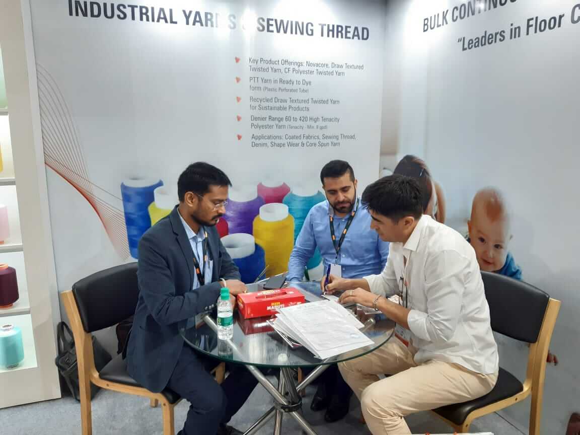 Business Discussion at an Exhibition Booth