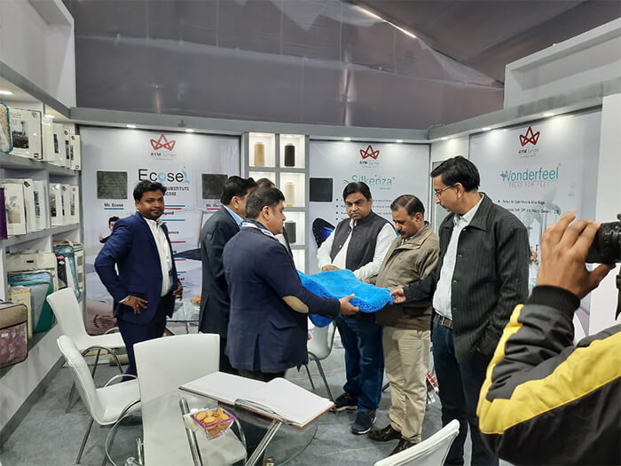 Reviewing Textile Samples at Trade Show India